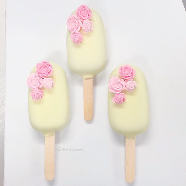 White Chocolate Coated Cake Popsicles with Pink Sugar Flowers